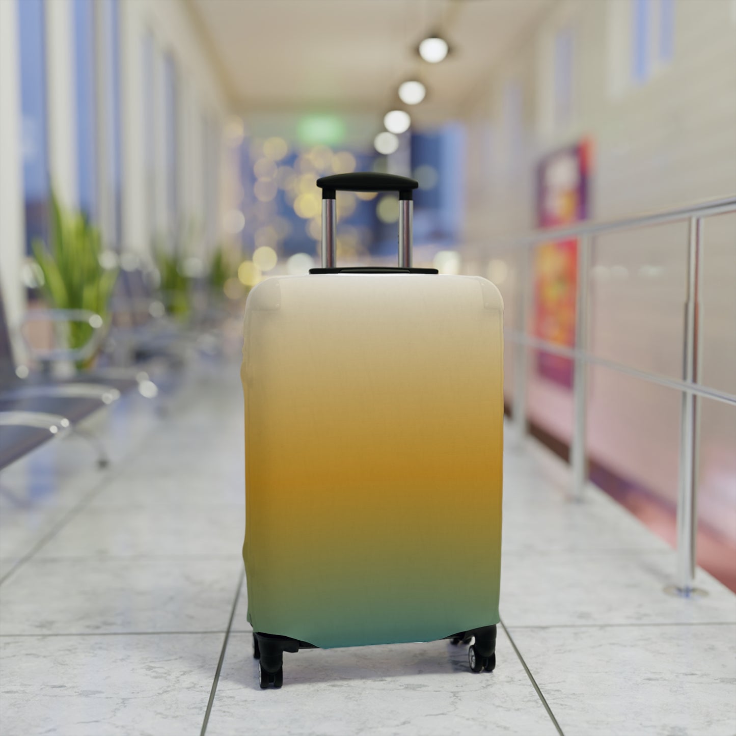 Baja Sunset gradient stretch luggage cover in golden amber and teal fitted on hard shell rolling suitcase