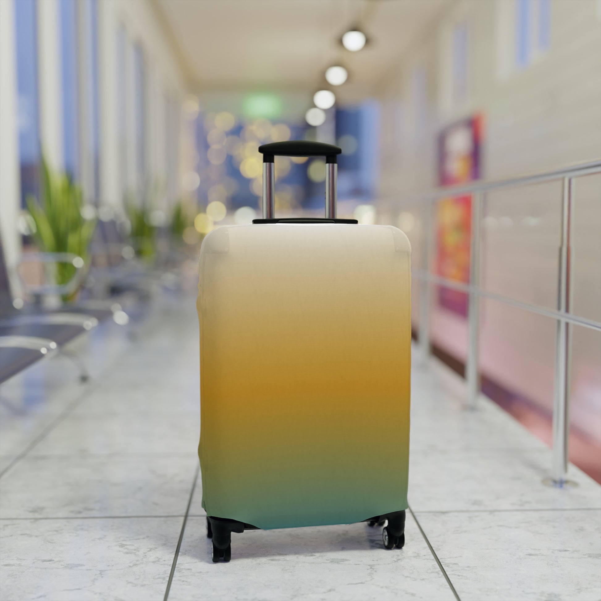 Baja Sunset gradient stretch luggage cover in golden amber and teal fitted on hard shell rolling suitcase
