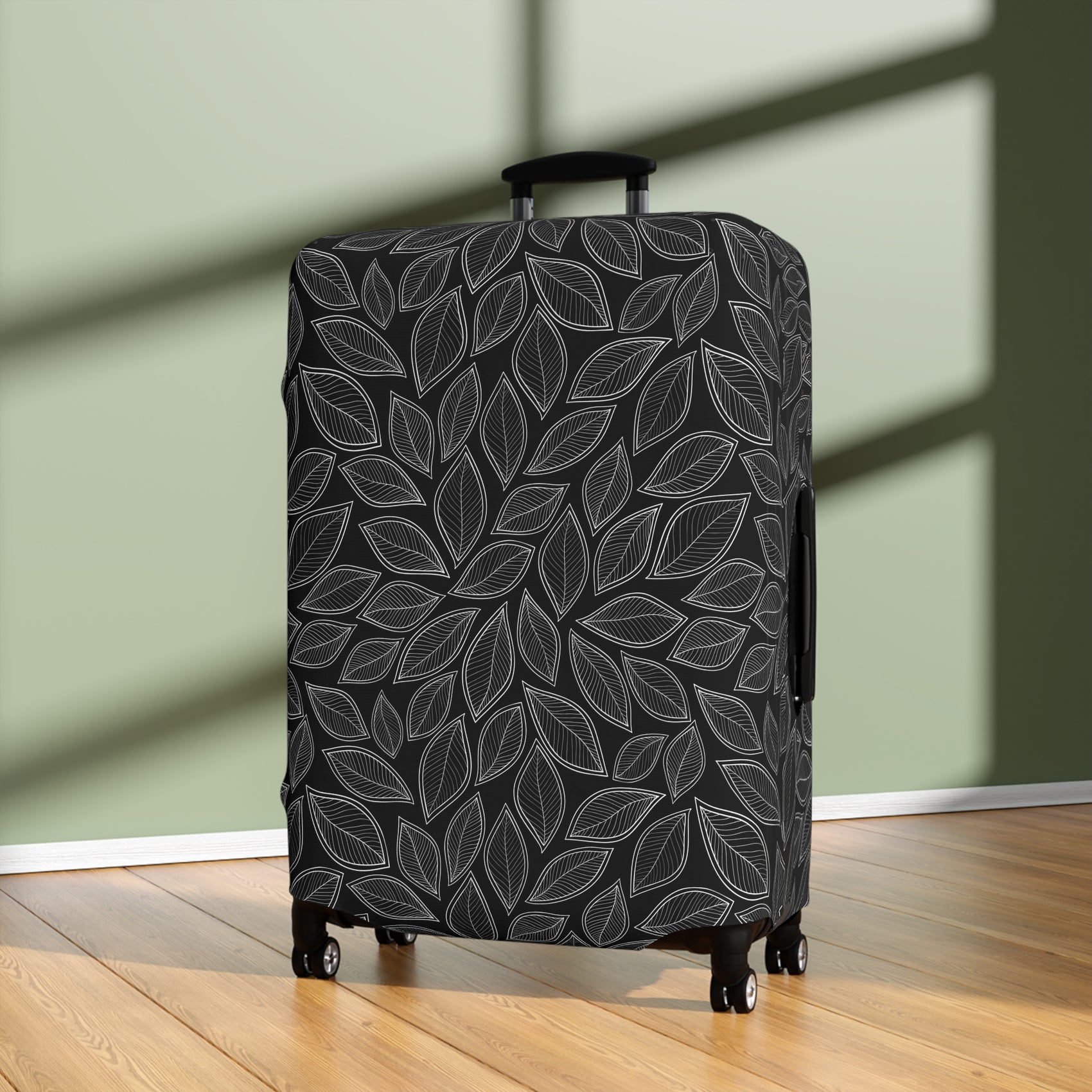 Central Park black stretch luggage cover with grey leaf pattern fitted on rolling suitcase