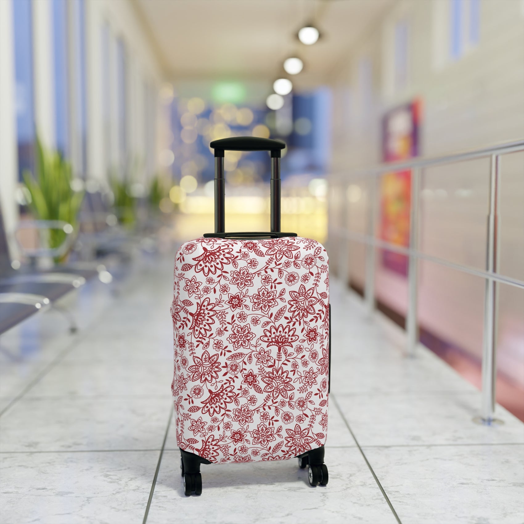 Folk Red stretch luggage cover with bold red floral pattern on white background