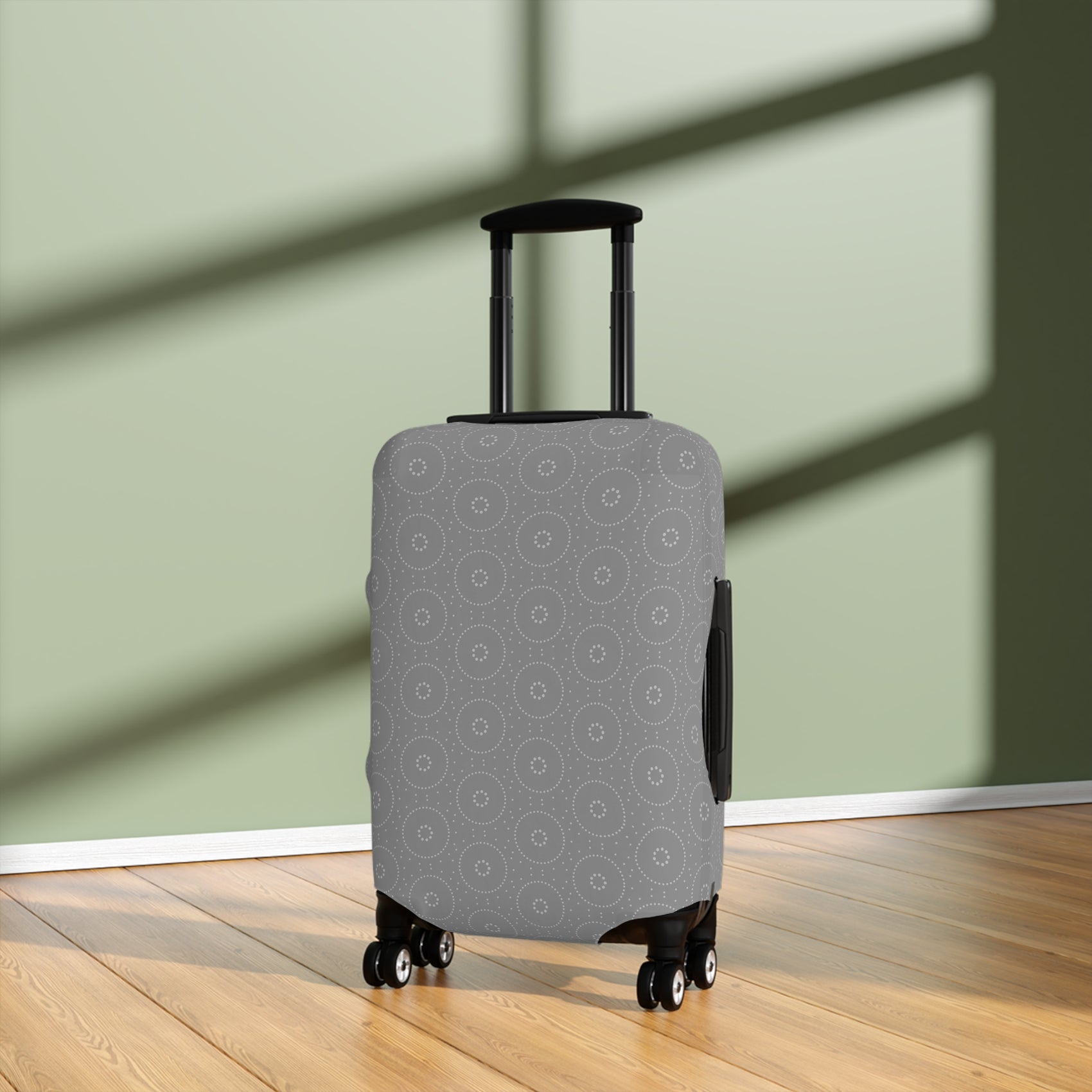 Lapland Lights gray stretch luggage cover with white circular snowflake pattern on rolling suitcase