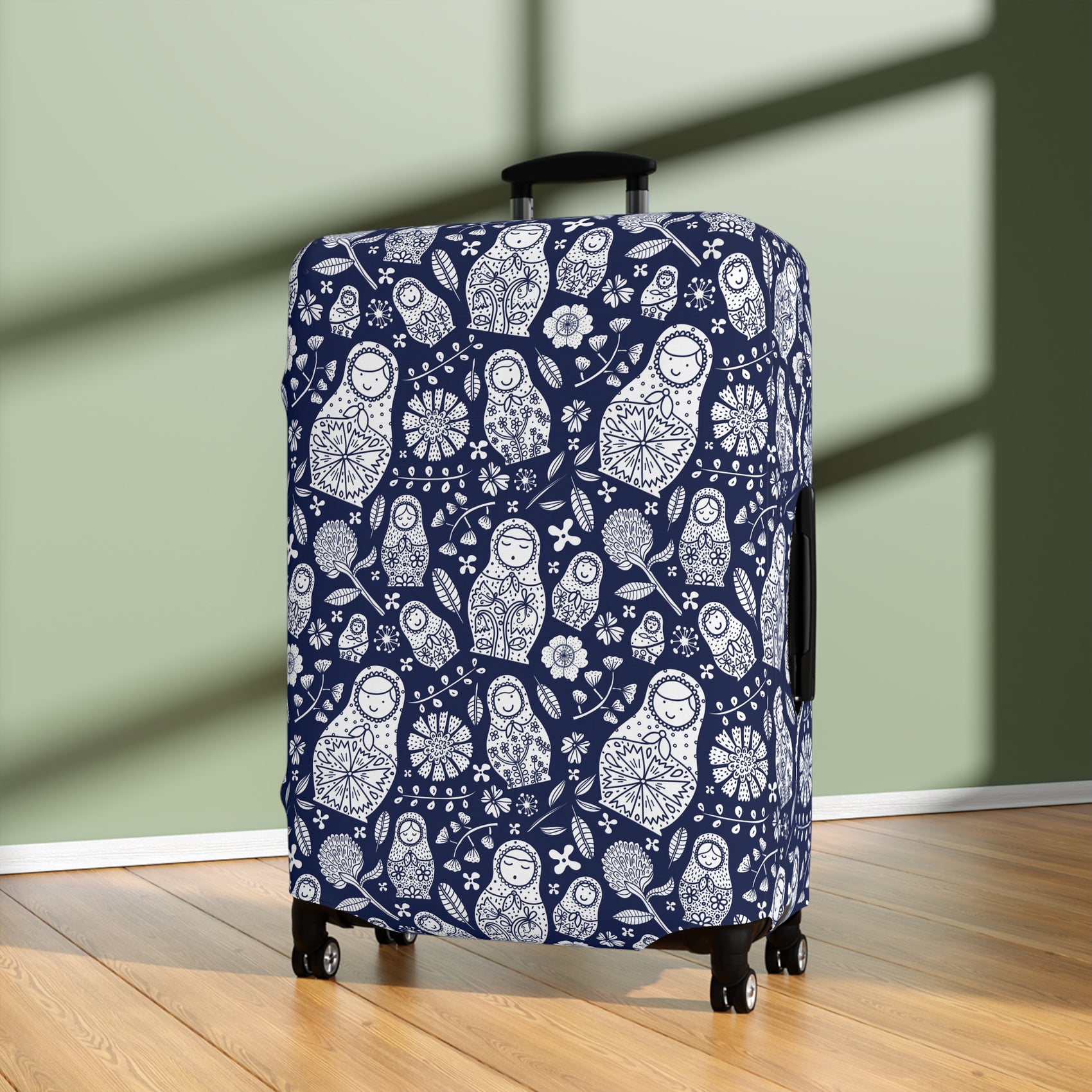 Matryoshka Blue folk art stretch luggage cover with white nesting doll pattern on deep blue background