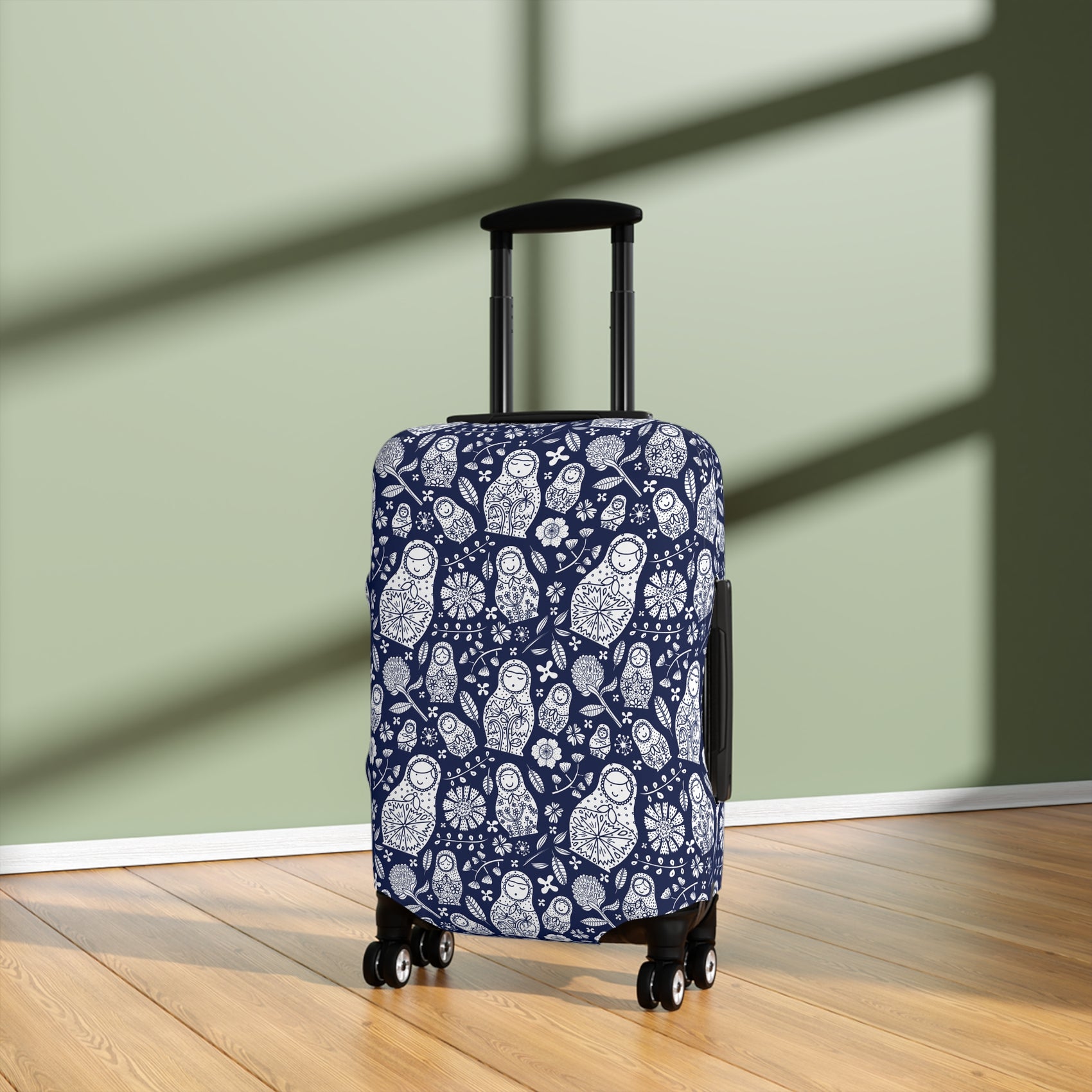 Matryoshka Blue folk art stretch luggage cover with white nesting doll pattern on deep blue background