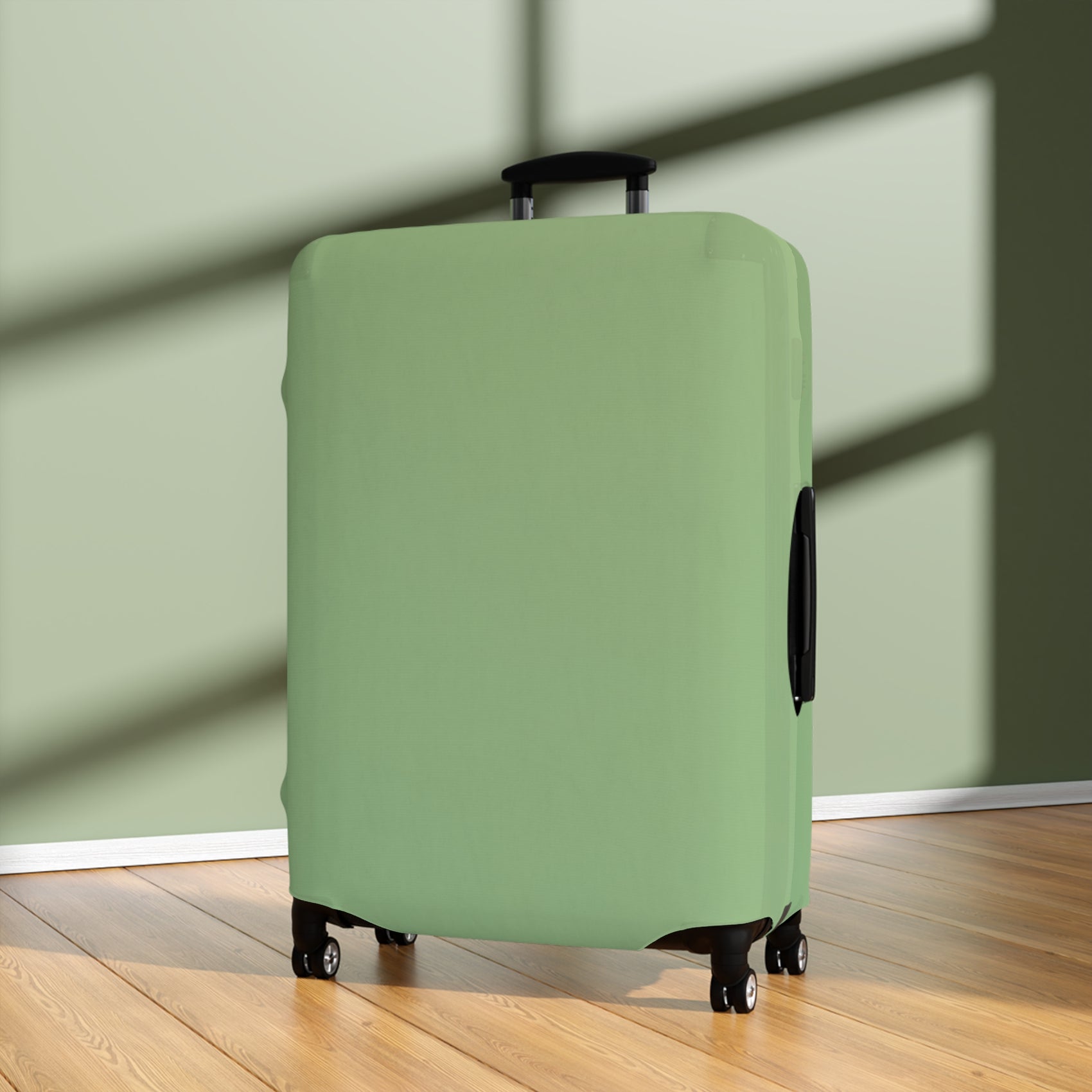 Green stretch luggage cover protecting a rolling suitcase with secure zipper closure
