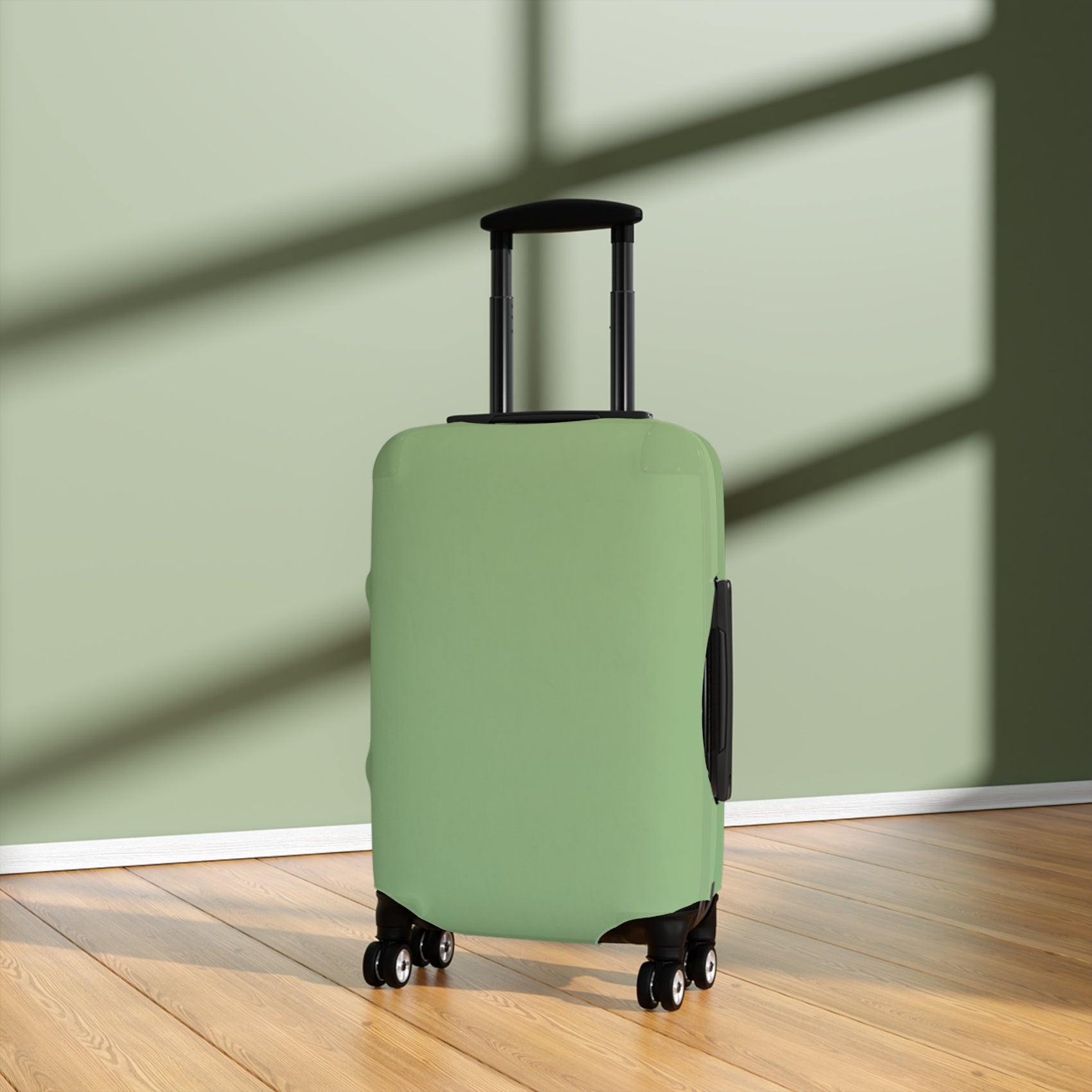 Green stretch luggage cover protecting a rolling suitcase with secure zipper closure