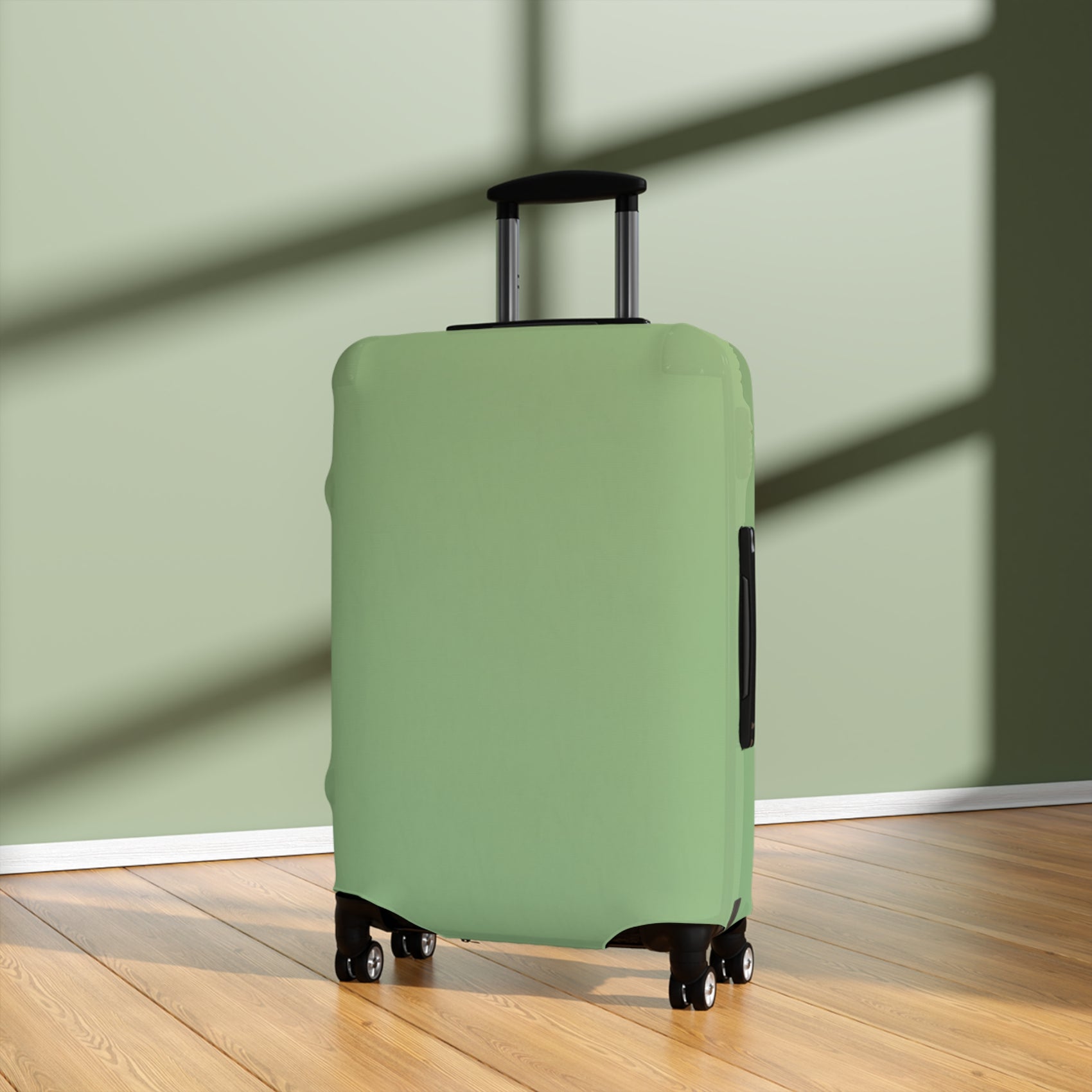 Green stretch luggage cover protecting a rolling suitcase with secure zipper closure