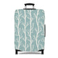Norwegian Dusk tree pattern stretch luggage cover with white winter trees on blue green suitcase