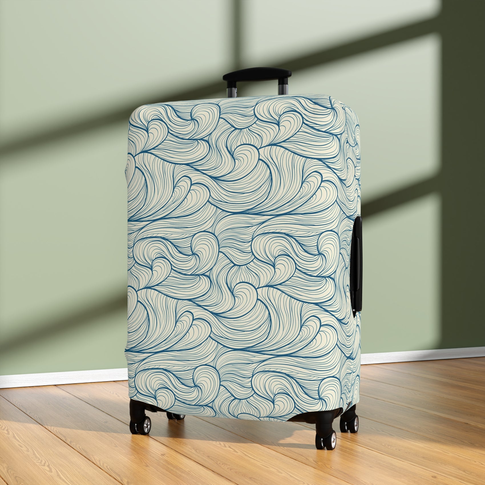 Blue wave patterned stretch luggage cover protecting a rolling suitcase
