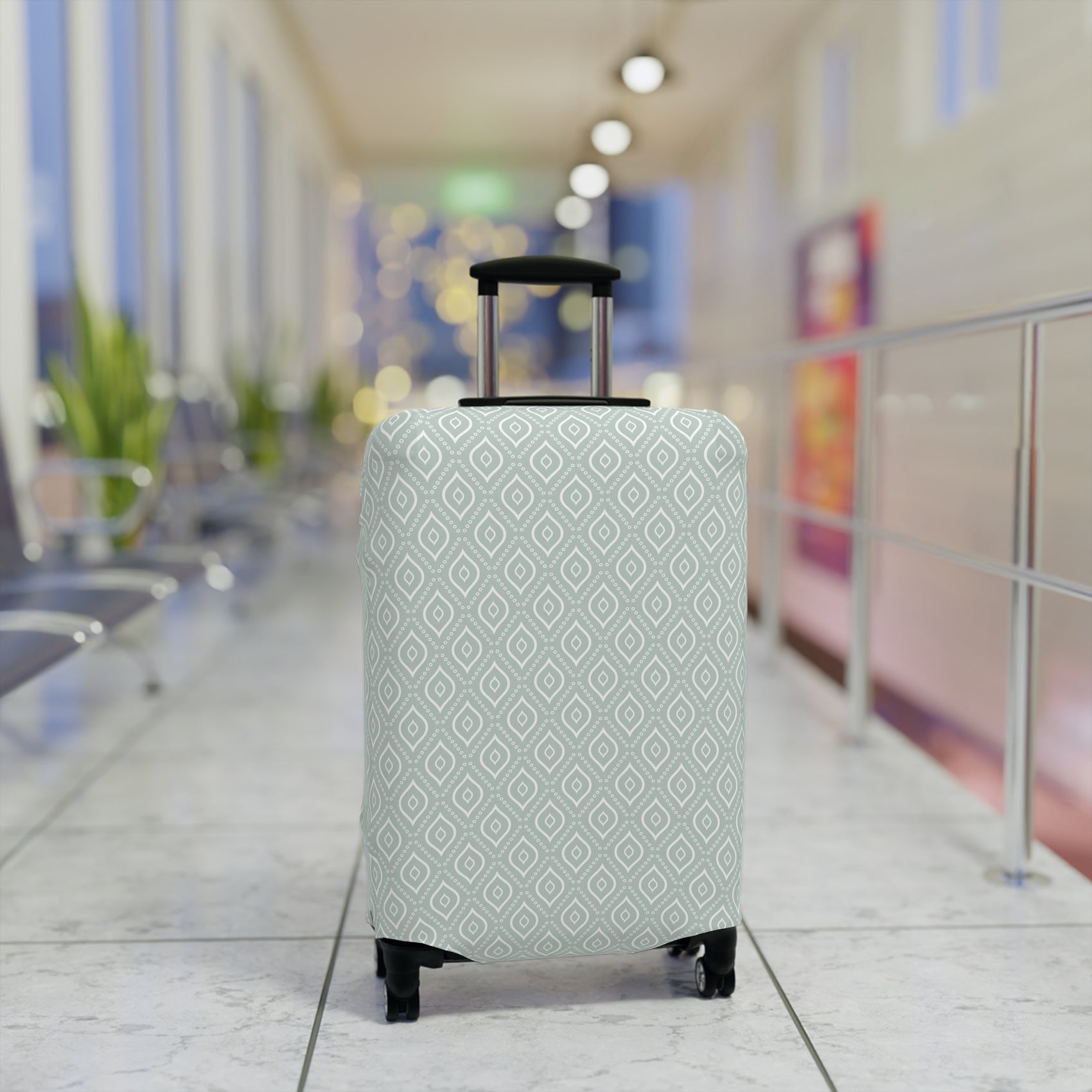 Persian Grace teal geometric stretch luggage cover with white diamond pattern on rolling suitcase