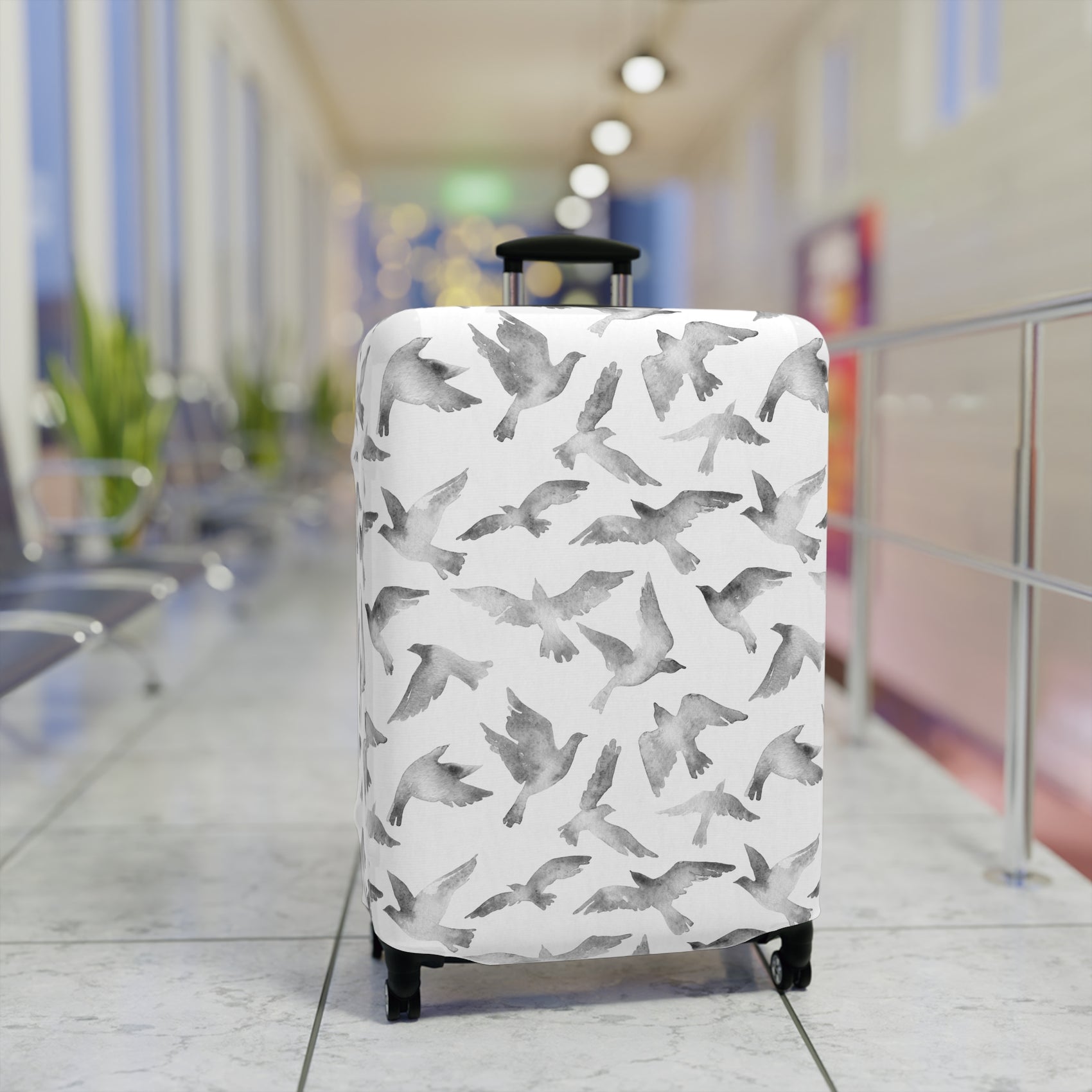 Streets to Sky stretch luggage cover with abstract gray bird silhouettes on white background