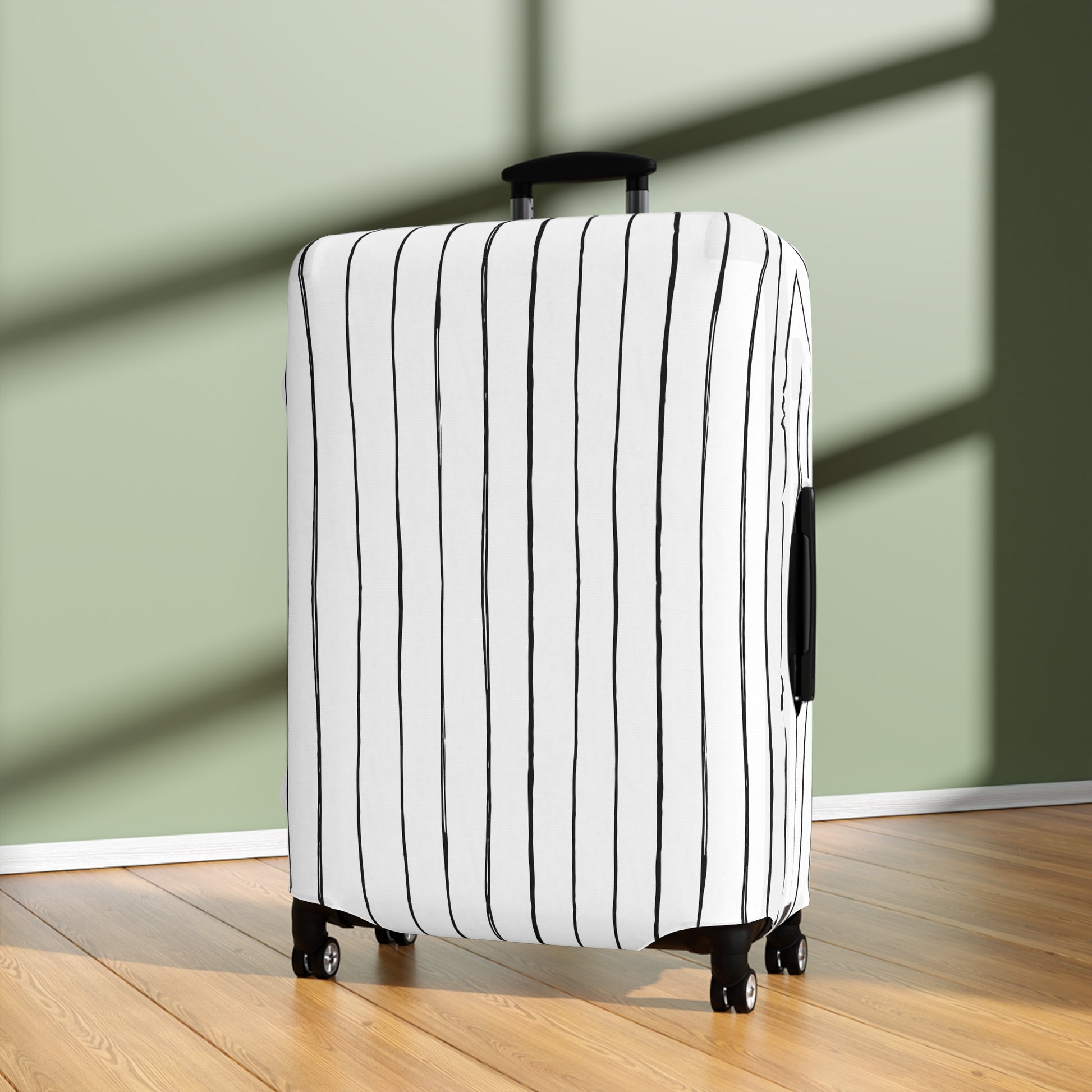Black and white striped stretch luggage cover with zipper closure protecting a rolling suitcase