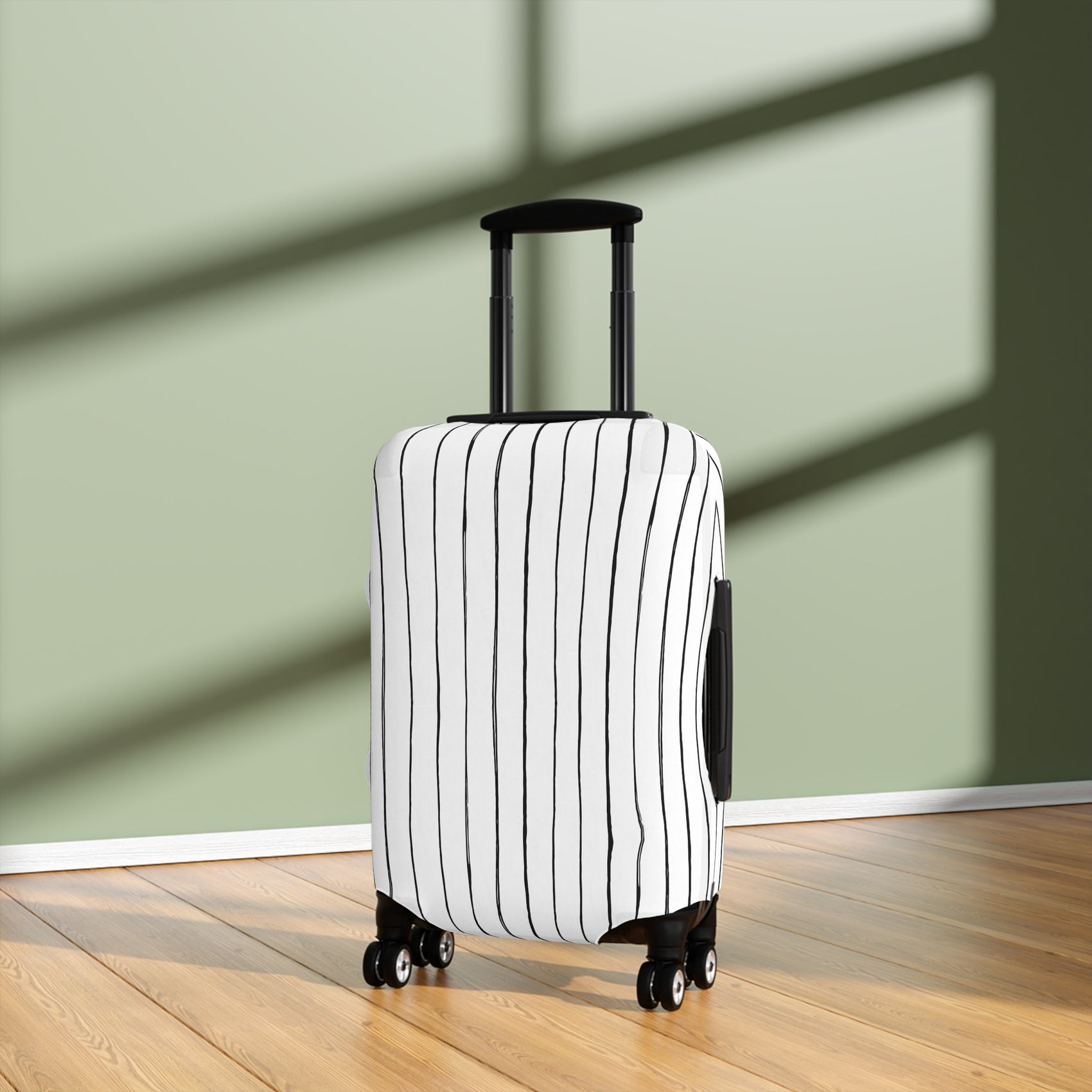 Black and white striped stretch luggage cover with zipper closure protecting a rolling suitcase