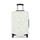 Urban Botanica stretch luggage cover with minimalist green leaf pattern on white background
