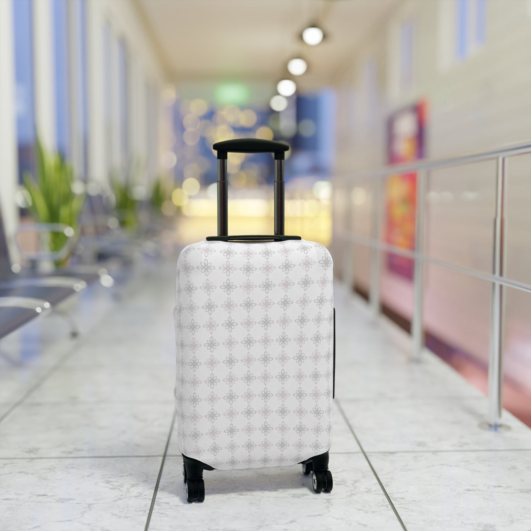 White floral minimalist stretch luggage cover protecting a rolling suitcase