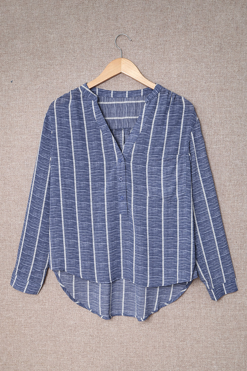 Blue Striped V-Neck Blouse - Front View Elegant Button-Down Blouse for Work & Travel Wear Soft & Lightweight Striped Long Sleeve Shirt for Jet Setters Business Casual Blouse Styled with Trousers for Travel Days Classic Striped Shirt with Pockets & Button Details - Perfect for Exploring