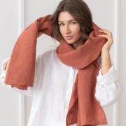Reddish Brown Stonewashed Linen Scarf with Hemmed Edge Soft Linen Scarf with Tassels in Warm Reddish Brown Lightweight Breathable Linen Scarf Draped Over Shoulder Elegant Unisex Linen Scarf Styled for All Seasons Close-up of Stonewashed Linen Texture in Natural Light