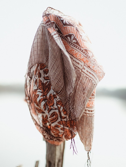 Hand-Dyed Cotton Scarf Naturally Dyed with Avocado and Madder Eco-Friendly Lightweight Cotton Scarf Draped Over Shoulders Soft Cotton Scarf in Earthy Tones with Natural Dye Variations Ethically Made Handwoven Scarf Styled as a Headwrap USA-Made Sustainable Fashion Scarf in Soft Cotton