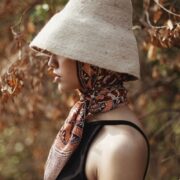 Hand-Dyed Cotton Scarf Naturally Dyed with Avocado and Madder Eco-Friendly Lightweight Cotton Scarf Draped Over Shoulders Soft Cotton Scarf in Earthy Tones with Natural Dye Variations Ethically Made Handwoven Scarf Styled as a Headwrap USA-Made Sustainable Fashion Scarf in Soft Cotton