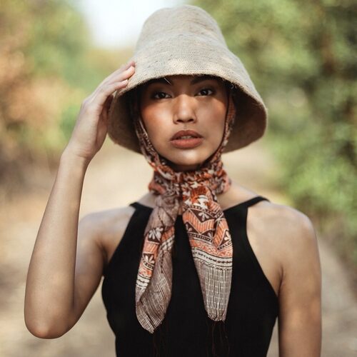 Hand-Dyed Cotton Scarf Naturally Dyed with Avocado and Madder Eco-Friendly Lightweight Cotton Scarf Draped Over Shoulders Soft Cotton Scarf in Earthy Tones with Natural Dye Variations Ethically Made Handwoven Scarf Styled as a Headwrap USA-Made Sustainable Fashion Scarf in Soft Cotton
