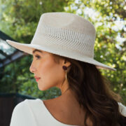Wide Brim Pinched Front Hat in natural color Boho Travel Hat - Side View in Grey Close-up of Pinch Crown Detail Stylish Wide Brim Hat for Sun Protection Adventure Travel Hat in Natural Color